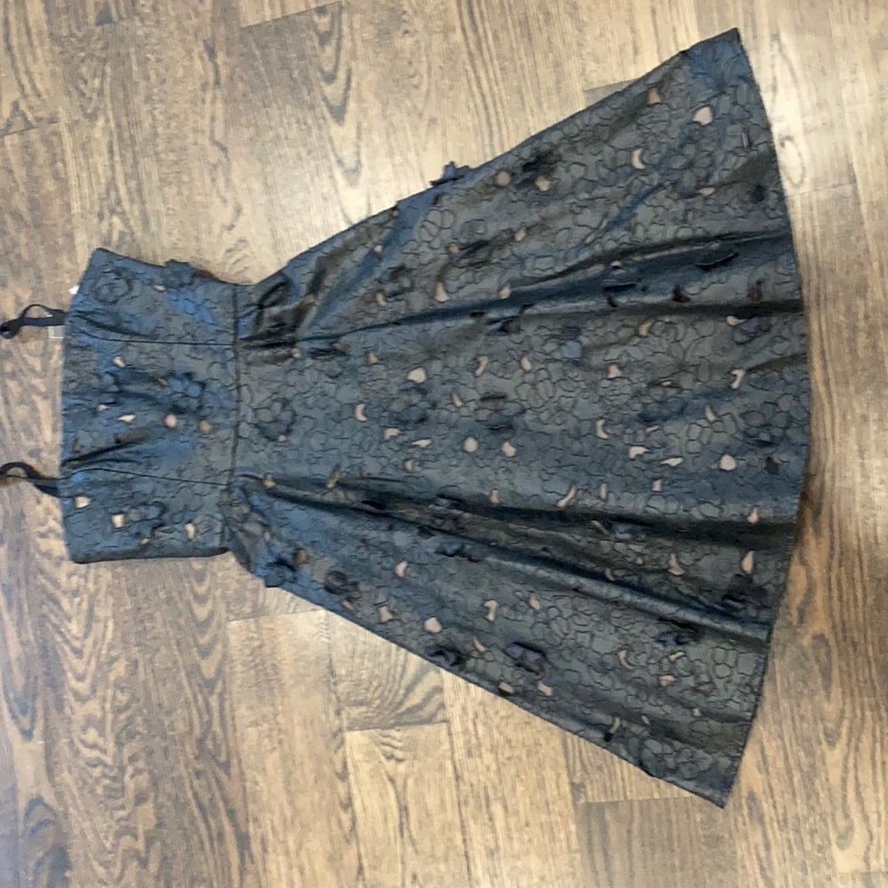 Black leather dress with flower cutouts